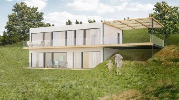 Moderní dům ve svahu s podkrovím a terasou